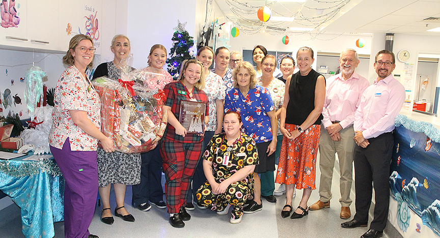 Staff in the Maternity Unit at Rockhampton hospital receiving a first place trophy for their Christmas decorations