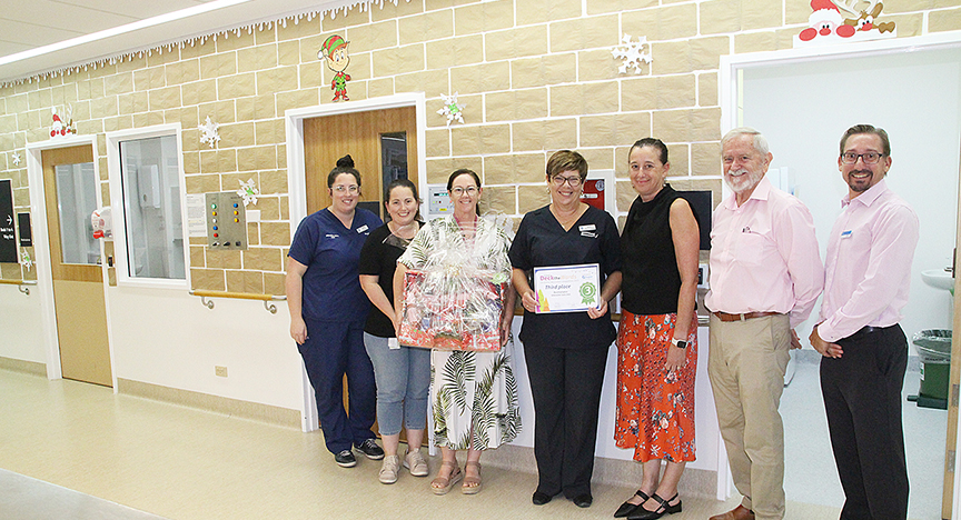 Staff at the Rockhampton Hospital Intensive Care Unit receiving a third place certificate for their Christmas decorations.