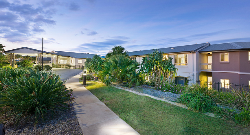 The sun sets on two buildings at the Sunset Ridge aged-care facility.