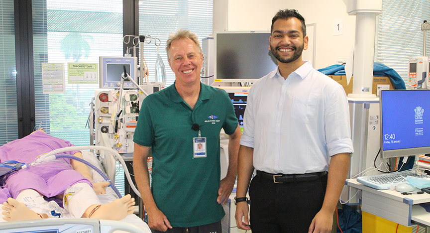 Photo of David Austin and Raqueeb Rasul in a hospital room